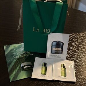 LA MER Travel Size / Samples with Silver Tipped Cooling Applicator & Mini Bag.